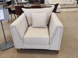Living room furniture showroom with various couches and decor items.