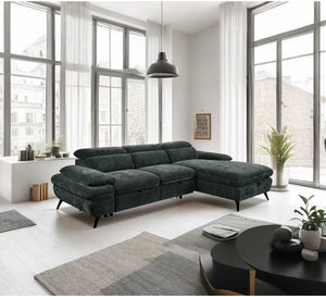 Modern living room with a dark green sectional sofa, coffee table, and decorative items.