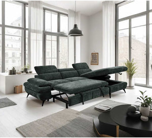 Modern living room with a sectional sofa bed, coffee table, and large windows.