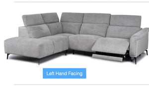 Gray sectional sofa with recliner feature on a white background