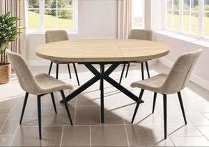 Extending Dining table with four chairs in a bright room with large windows.